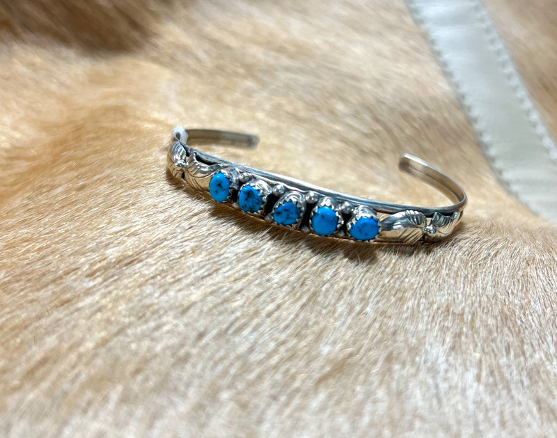 Silver bracelet with five turquoise stones