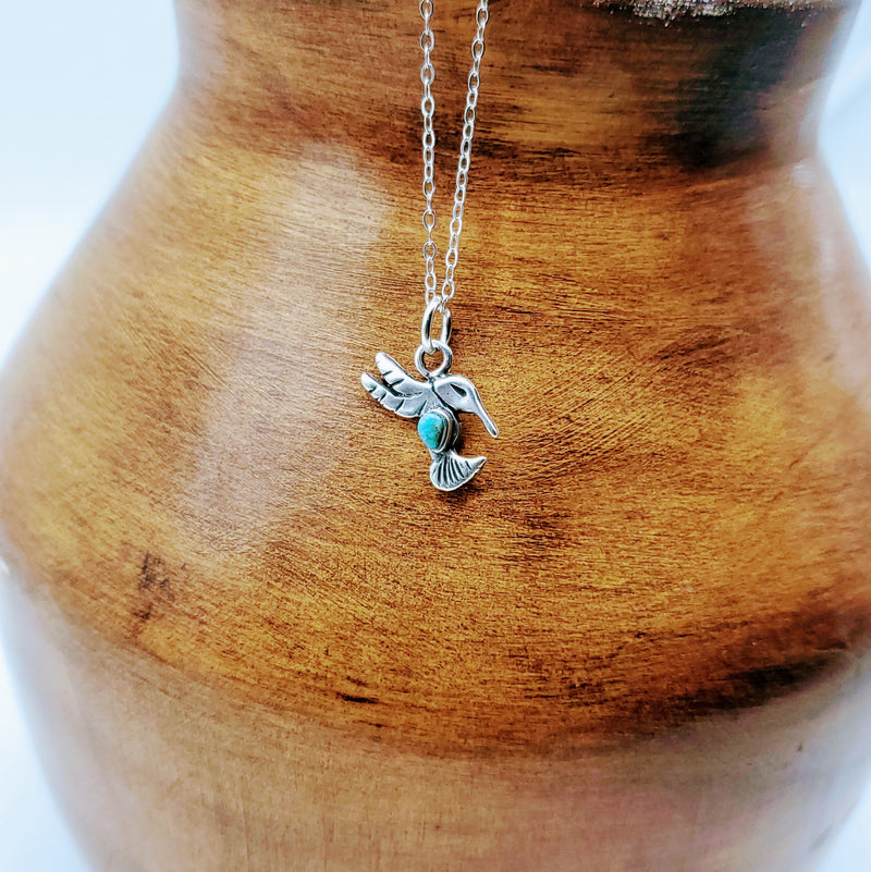 Silver Hummingbird with turquoise in center