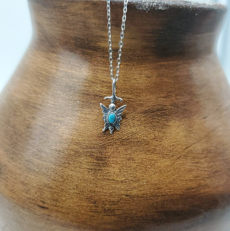 Tiny Silver Butterfly with tiny turquoise and pointed wings. Silver Chain